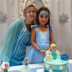 Birthday Baby with Frozen cake