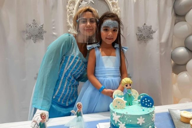 Birthday Baby with Frozen cake